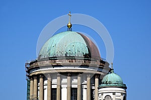 Green copper plated cupola roofing in process of replacement with shiny new red copper. renovation concept