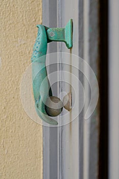 Green copper door knocker