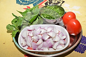 The green corianders and onion mint with tometo photo