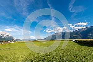 Austrian Alps with Corn Fields and Meadows