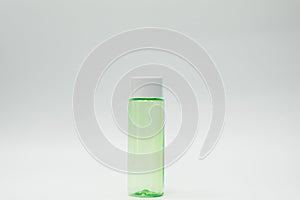 Green cosmetic bottle isolated
