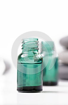 Green cosmetic bottles, essential oil