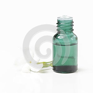 Green cosmetic bottles, essential oil