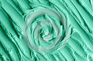 Green cosmetic clay kelp facial mask, face cream, spirulina body wrap texture close up, selective focus. Abstract background