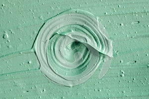 Green cosmetic clay texture close up