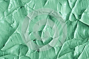 Green cosmetic clay texture close up