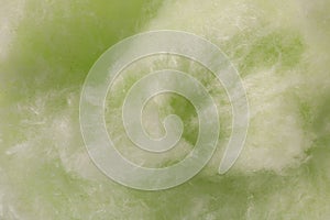 Green cotton candy as background, closeup view