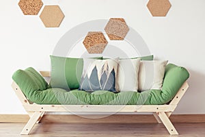 Green couch and cork decor