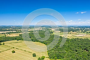 The green countryside with its forests and fields in Europe, France, Burgundy, Nievre, towards Nevers, in summer, on a sunny day