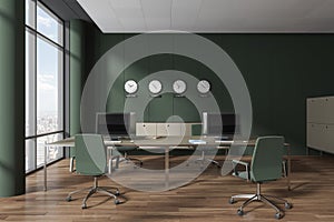 Green coworking interior with furniture, sideboard with clock and window