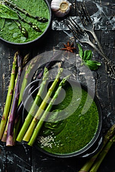 Green Cream soup with spinach and asparagus. Healthy food. Top view. Free space for your text