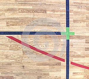 Green cross of lines. Shining floor of sports gymnasium