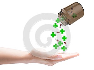 Green cross and pills falling