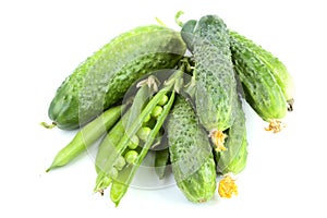 Green cucumbers and peas isolated