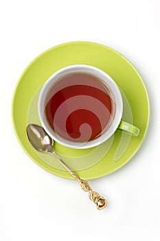 Green cup of tea isolated on white