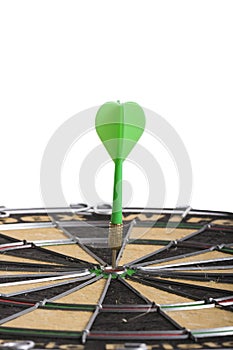 Green Dart hitting the middle of dartboard