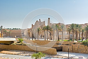 Green date trees growing in the park in the Ruins of Diraiyah, also as Dereyeh and Dariyya, a old town in Riyadh, Saudi Arabia photo