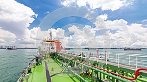 Green deck of the tanker under blue sky timelapse