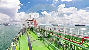 Green deck of the tanker under blue sky timelapse