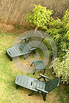 Green Deckchairs in a Garden