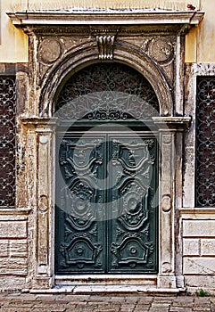 Green decorated carved door in Venice Ghetto.