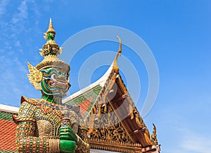 Green Demon Guardian Statue against Blue sky Backg