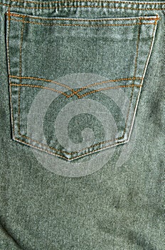 Green denim jeans detail.
