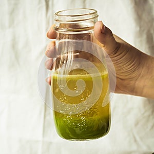Green detox juice with apple, kale, lemon and celery