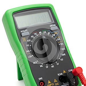 Green digital multimeter with black dial and red probe on white background electrical electronic