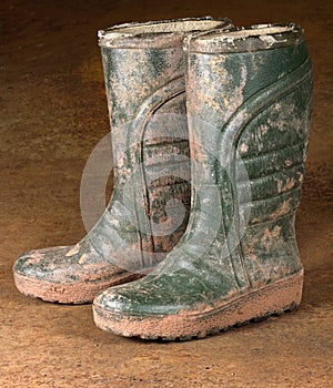 Green dirty rubber boots