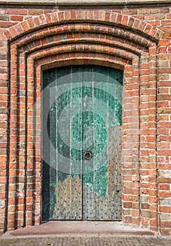 Green door of the church of Loppersum photo