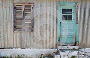 Green door,closed shutter,Assos,Kefalonia,Greece