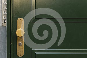 Green door with golden knob