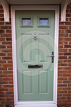 Green door. Modern house composite UPVC front door