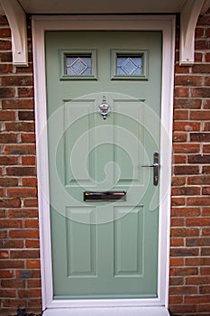 Green door. Modern house composite UPVC front door photo