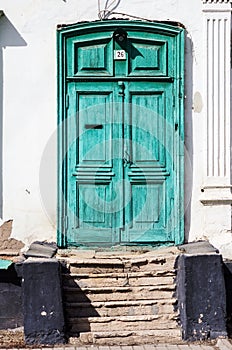 The green door of the old house, a fragment of the facade