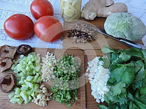 Green dough, tomatoes, onio, greenary and mushrooms cooking