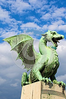 Green Dragon is main symbol of Ljubljana. It is one of four statues that adorn the famous Dragon bridge Zmajski most. photo