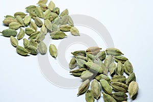 Green Dried cardamom seeds isolated on white background