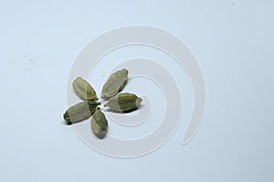 Green Dried cardamom seeds isolated on white background