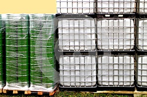 Green drums and white container