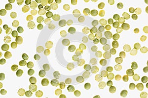 Green dry purified peas closeup top view on white background.