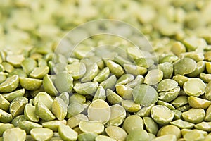 Green dry purified peas macro background.