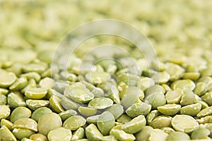 Green dry purified peas macro background.