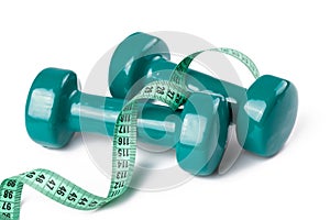 Green dumbell with measuring tape