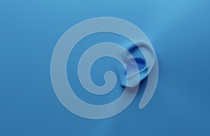 Green ear on a blue background, health care or alertness concept, 3d render