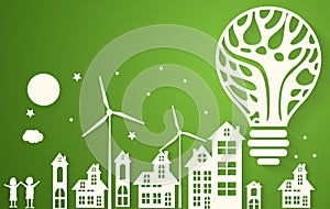 Green eco city with dry tree in light bulb eco concept