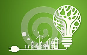 Green eco city with dry tree in light bulb eco concept