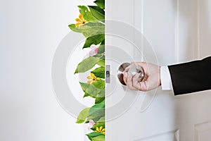 Green and eco-friendly business, Businessman opening door, with leaves and flower
