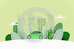 Green electric car charging at the charger station on the street with green city skyline in the background. Sustainable energy and